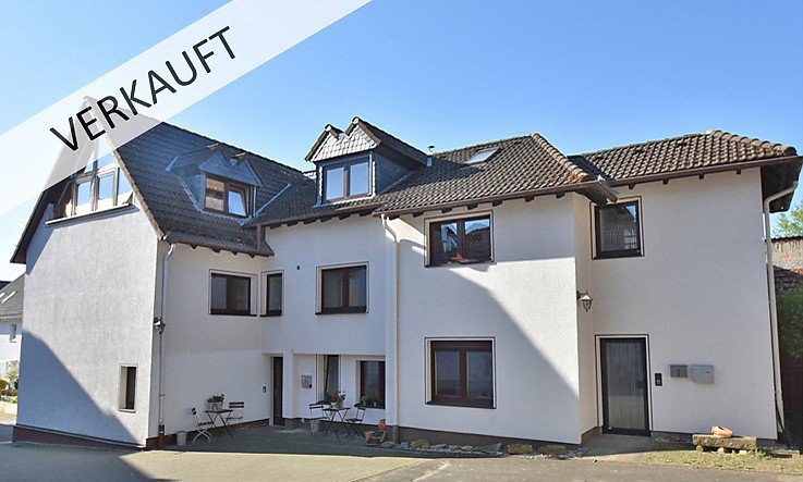 Foto 3-Parteien-Haus mit großem Grundstück in Dornholzhausen